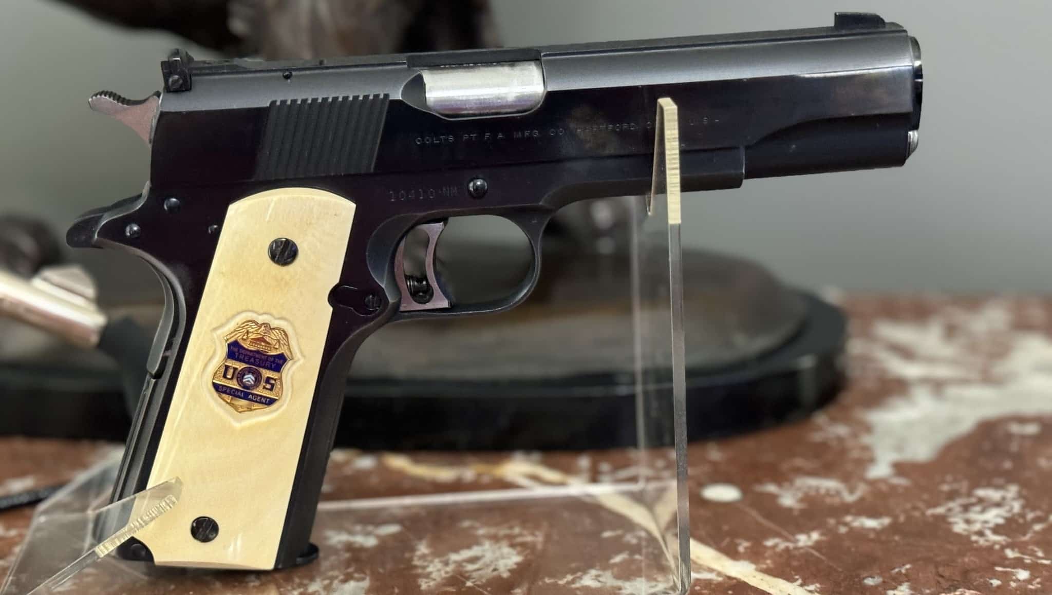 1962 Colt Gold Cup wearing ivory grips